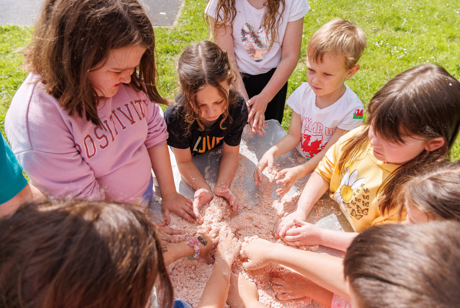 Children enjoying sensory play outdoors